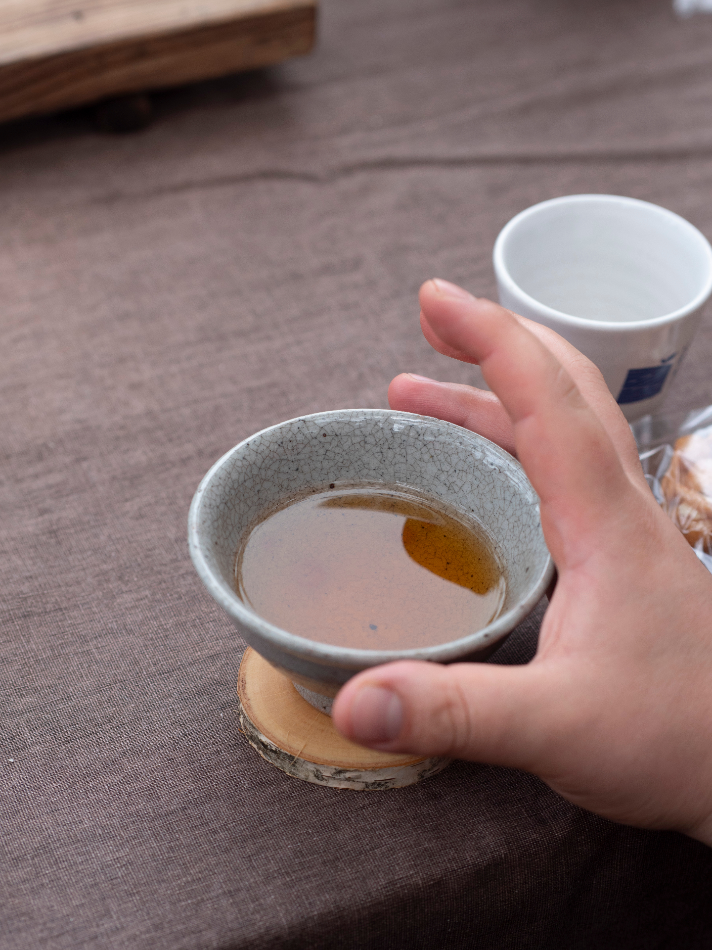 Traditional Korean tea ceremony with handcrafted ceramic cups and mindful preparation